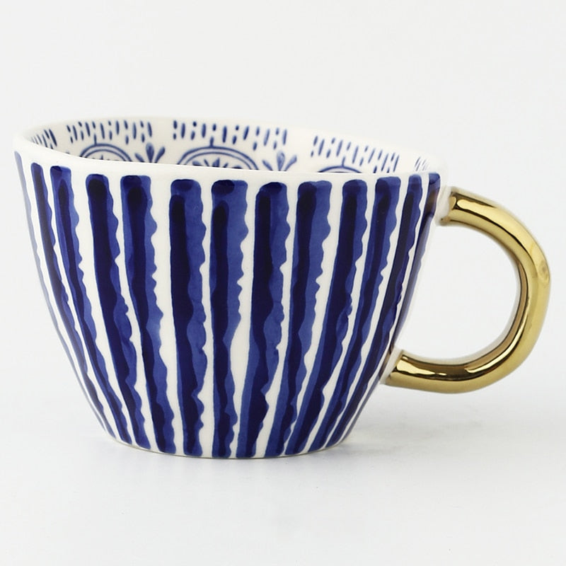 Maliben | Cup with abstract geometric pattern and gold handle