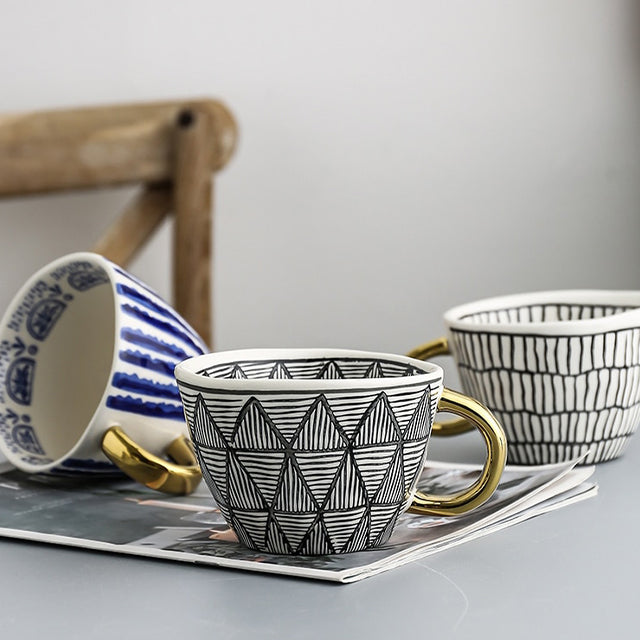 Maliben | Cup with abstract geometric pattern and gold handle